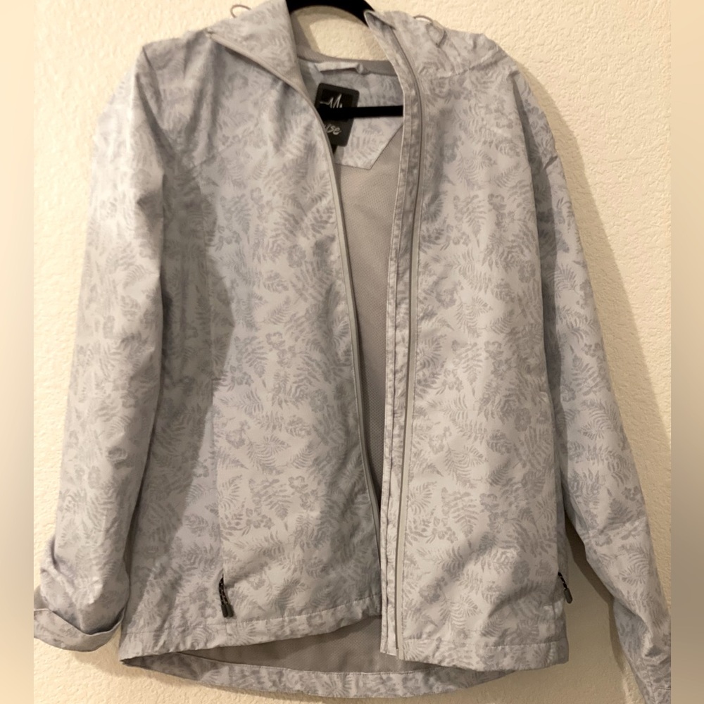 Womens Pulse waterproof shell jacket, size small. Brand new with tags